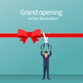 Businessman is hold big scissors cutting red ribbon