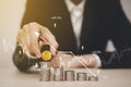 Businessman is hold bitcoin on Coins stack of a business network on background. bitcoin cryptocurrency ideas concept and virtual f Royalty Free Stock Photo