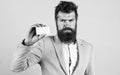 Businessman hold blank card. Bearded hipster serious face show card. Banking services for business. Business card design