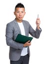 Businessman hold with file board and pen point up Royalty Free Stock Photo