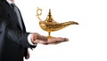 Businessman hold a genie lamp of aladdin. concept of desire and make a wish come true