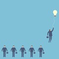 Businessman hold the light bulb floating to the sky Royalty Free Stock Photo