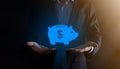 Businessman hold piggy bank icon .Business and Money spending planning, and investment budget, Business saving money concept.save Royalty Free Stock Photo