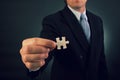 A businessman hold a puzzle piece Royalty Free Stock Photo