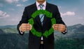 Businessman hold Recycle symbol Green Grass Eco Environment forest Mountain Royalty Free Stock Photo