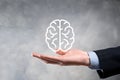 Businessman holding abstract brain and icon digital marketing, strategy and growtn investment business target goal, media and Royalty Free Stock Photo