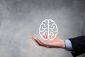 Businessman holding abstract brain and icon digital marketing, strategy and growtn investment business target goal, media and Royalty Free Stock Photo
