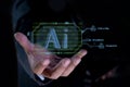 Businessman holding AI. technology smart robot science and artificial intelligence technology, concept of AI technology, smart Royalty Free Stock Photo