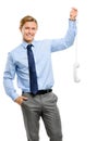 Businessman holding analogue phone isolated on white background