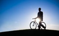 Businessman Holding Bicycle Silhouette Hill Concept