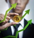 Businessman Holding Bitcoin With Green 3D Arrow up. Bitcoin Price Going Up Concept