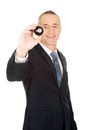 Businessman holding black billiard ball Royalty Free Stock Photo