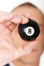 Businessman holding black billiard ball Royalty Free Stock Photo