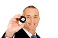 Businessman holding black billiard ball Royalty Free Stock Photo