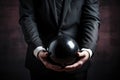 Businessman holding a black weight ball. Unpaid debts. Obligations under the terms of the contract. Guilt and psychological