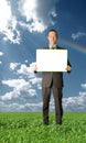 Businessman holding blank card outdoors Royalty Free Stock Photo