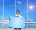 Businessman holding blank plasma panel Royalty Free Stock Photo