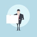 The businessman holding a blank sheet and pointing by index finger. Royalty Free Stock Photo