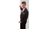 Businessman holding a blank sign in front of him Royalty Free Stock Photo