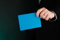 Businessman Holding a Blue Card, Empty, Copy Space. Royalty Free Stock Photo