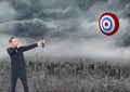 Businessman holding bow and arrow while aiming at the target board Royalty Free Stock Photo