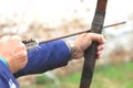 Businessman holding bow and shooting to archery target. Royalty Free Stock Photo