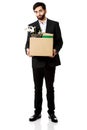 Businessman holding box with personal belongings.