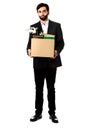 Businessman holding box with personal belongings.