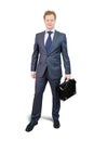Businessman holding brief case Royalty Free Stock Photo