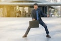 Businessman holding a briefcase, powerful businessman