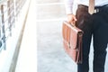 Businessman holding a briefcase travellers walking outdoors Royalty Free Stock Photo