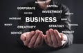 Businessman holding Business words. Business concept Royalty Free Stock Photo