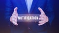 Businessman holding button notification on virtual screens, business, technology, internet and networking concept Royalty Free Stock Photo