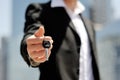 Businessman holding a car key in his hand - new car buy sale concept Royalty Free Stock Photo