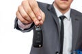 Businessman holding car keys isolated on white Royalty Free Stock Photo