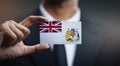 Businessman Holding Card of British Antarctic Territory Flag