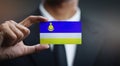 Businessman Holding Card of Buryatia Flag