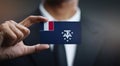 Businessman Holding Card of French Southern Flag