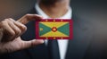 Businessman Holding Card of Grenada Flag