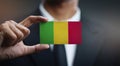 Businessman Holding Card of Mali Flag