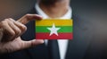 Businessman Holding Card of Myanmar Flag