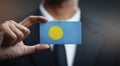 Businessman Holding Card Palau Flag