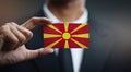 Businessman Holding Card of Republic of Macedonia Flag Royalty Free Stock Photo