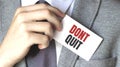 Businessman holding a card with text DONT QUIT