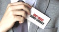 Businessman holding a card with text Dont resist change embrace