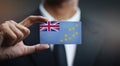 Businessman Holding Card of Tuvalu Flag