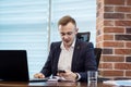 Businessman holding a cell phone and writing sms message in office,businessman use mobile smart phone,Close up of a man using mob Royalty Free Stock Photo