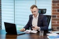 Businessman holding a cell phone and writing sms message in office,businessman use mobile smart phone,Close up of a man using mob Royalty Free Stock Photo