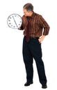 Businessman holding clock