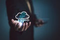 Businessman holding a cloud computing interface with data flow, analytics charts, and digital network elements, representing Royalty Free Stock Photo